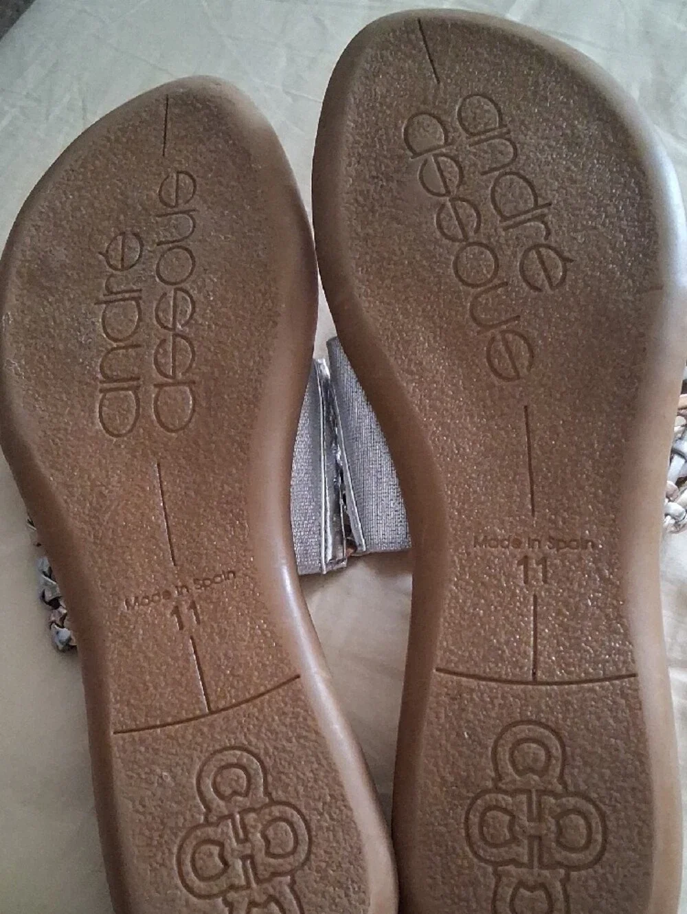 Fancy Andre Assous Silver Woven Thong Sandals on Brown Footbed